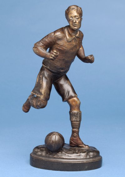 Footballer running with the ball, c.1900 by G. Omerth